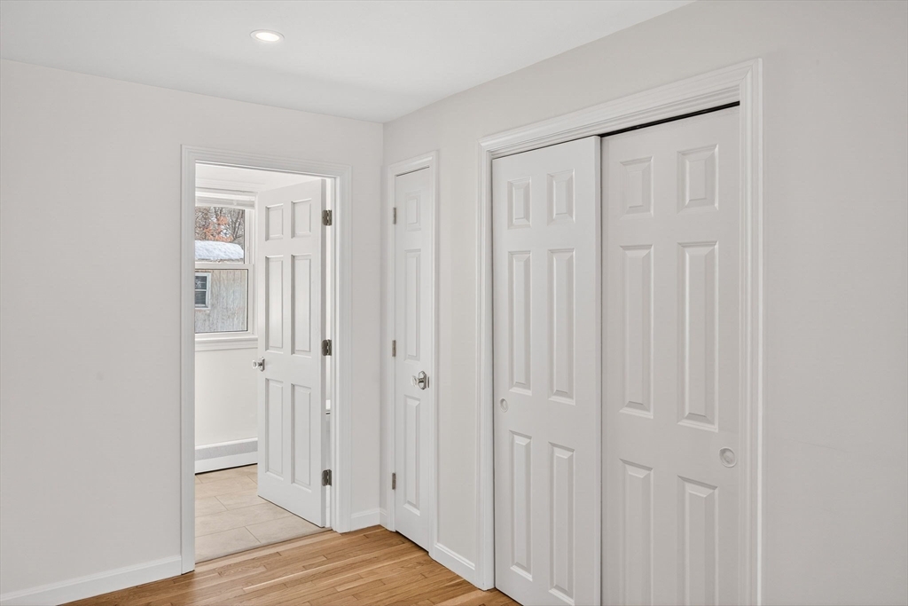 585 Old Falmouth Road Barnstable, MA 02648 - Photo 18 of 40 a view of a bedroom with wooden floor