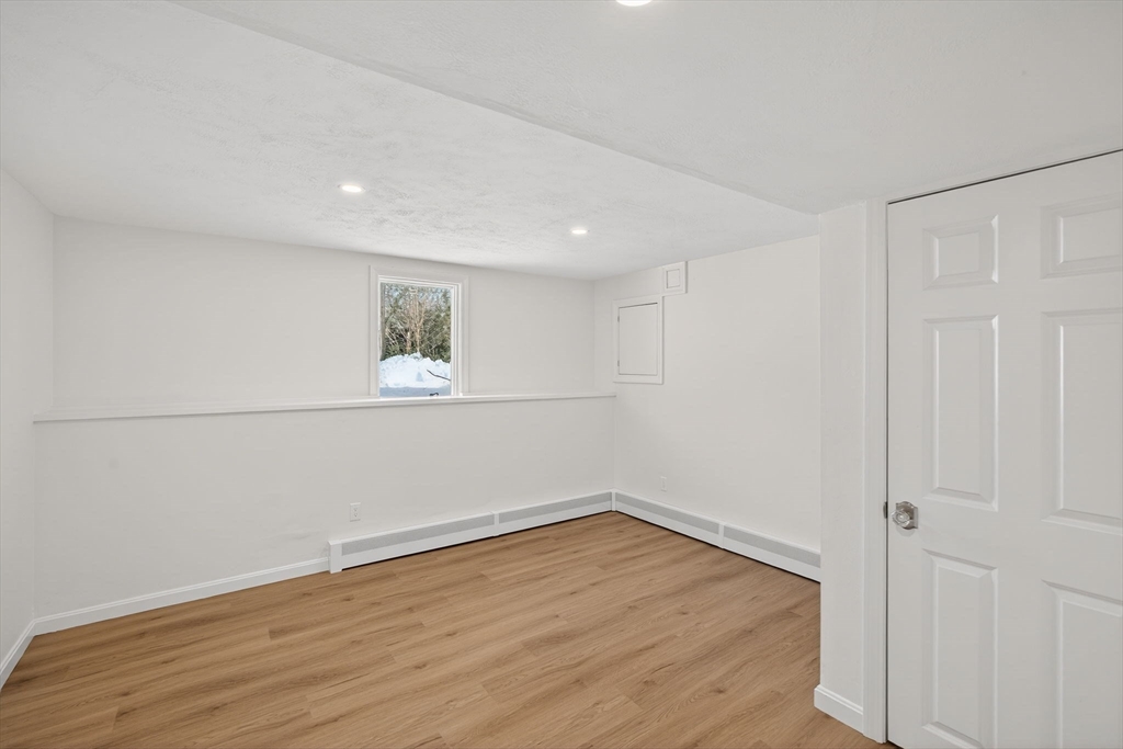 585 Old Falmouth Road Barnstable, MA 02648 - Photo 30 of 40 a view of a room with wooden floor and white walls
