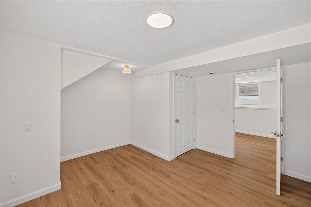 585 Old Falmouth Road Barnstable, MA 02648 - Photo 33 of 40 a view of empty room with wooden floor