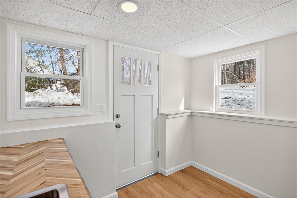 585 Old Falmouth Road Barnstable, MA 02648 - Photo 34 of 40 a view of a bedroom with wooden floor and window