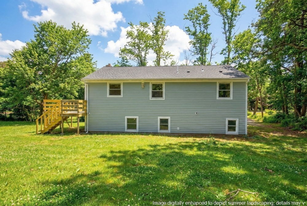 585 Old Falmouth Road Barnstable, MA 02648 - Photo 4 of 40 a view of a house with a yard