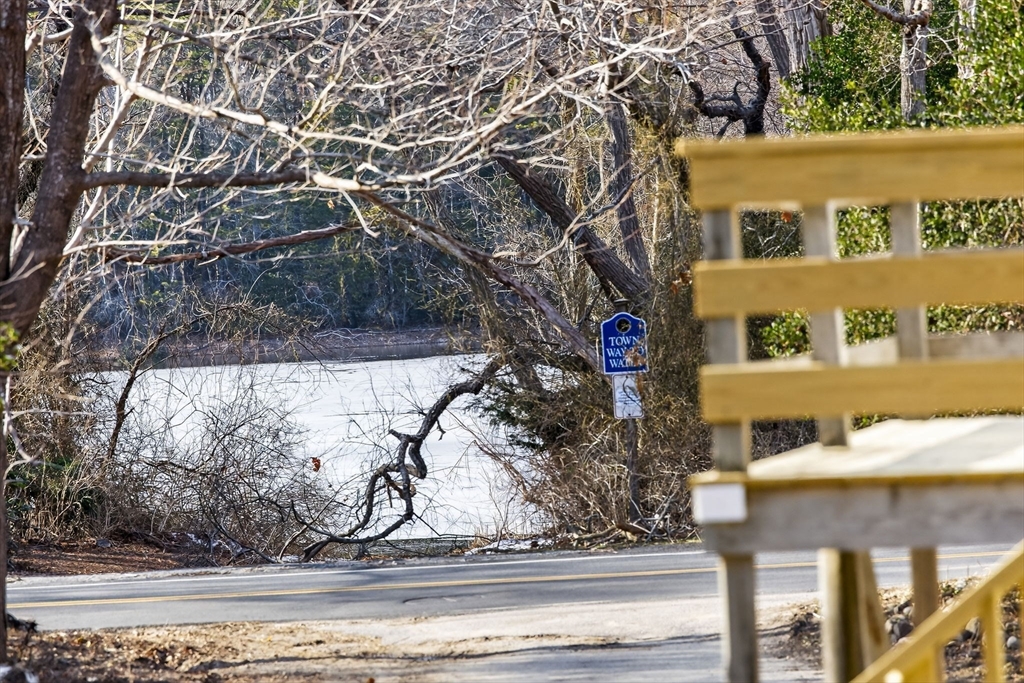 585 Old Falmouth Road Barnstable, MA 02648 - Photo 6 of 40 a view of a house with a yard and large tree