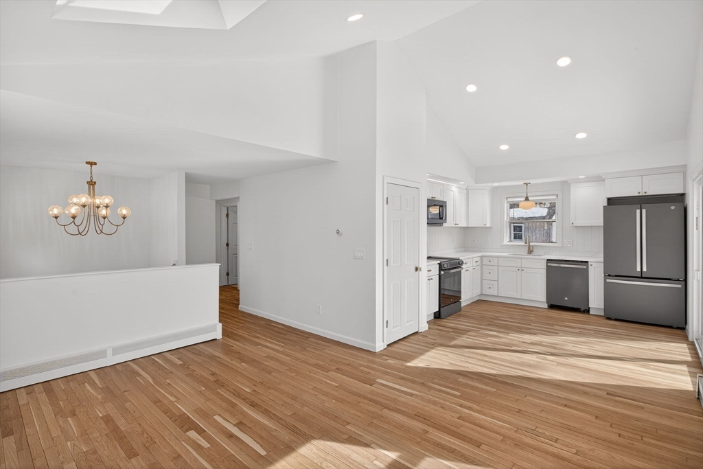 585 Old Falmouth Road Barnstable, MA 02648 - Photo 8 of 40 a view of a kitchen with kitchen island wooden floor center island and stainless steel appliances