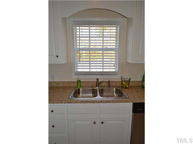 5660 Zacks Mill Road Angier, NC 27501 - Photo 13 of 24 new sink and faucet, new 2" blinds and kitchen with great view of the rear yard. Kitchen