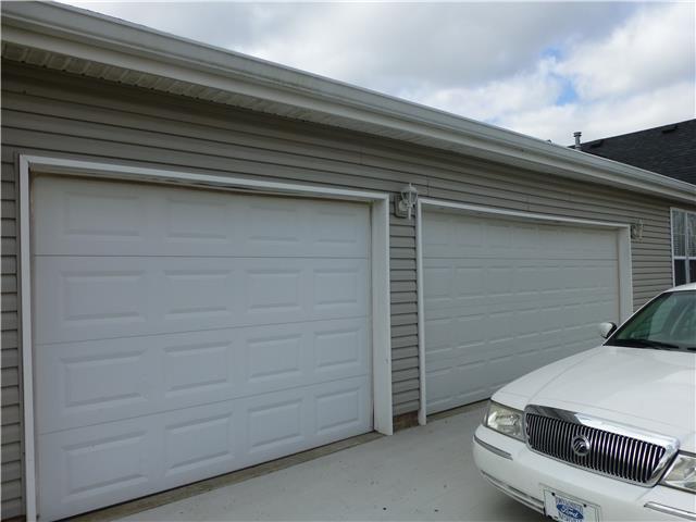 5501 Hunters Point Pike Lebanon, TN 37087 - Photo 2 of 14 Three car side entry garage with only a few steps into the home. Plus plenty outdoor parking space on cement drive (near home). The third garage bay is a drive thru with a full garage door on opposite side
