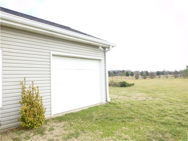 5501 Hunters Point Pike Lebanon, TN 37087 - Photo 3 of 14 One garage door opening up in fence backyard. Fabulous level over 1.5 acre lot!