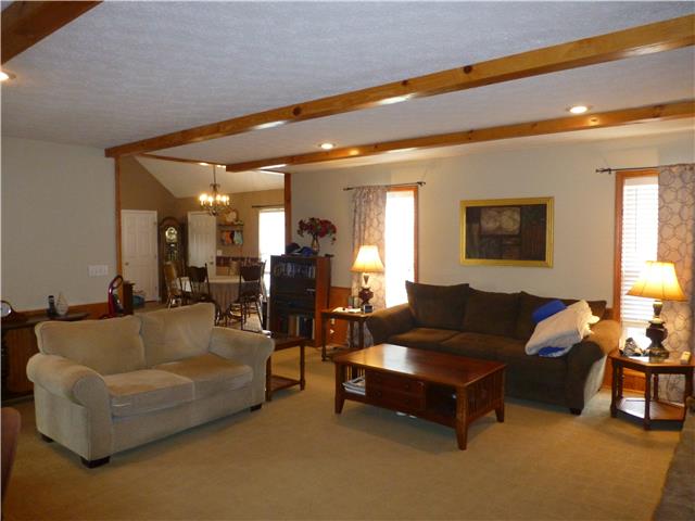 5501 Hunters Point Pike Lebanon, TN 37087 - Photo 6 of 14 View from the living room with wood beam ceiling towards the dining room with vaulted ceiling