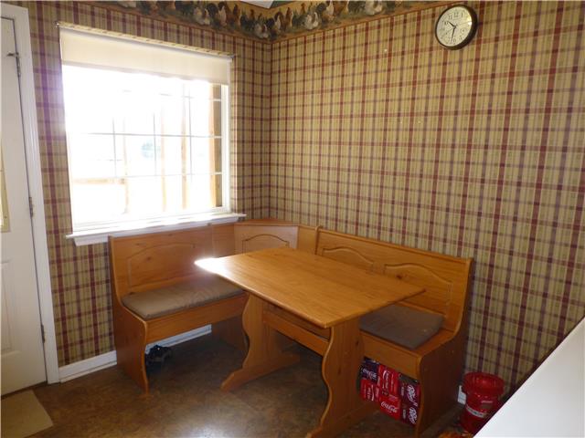 5501 Hunters Point Pike Lebanon, TN 37087 - Photo 9 of 14 Breakfast nook in kitchen with corner bench and table -- that stay with home. Window overlooks back of the 1.5 plus acre lot