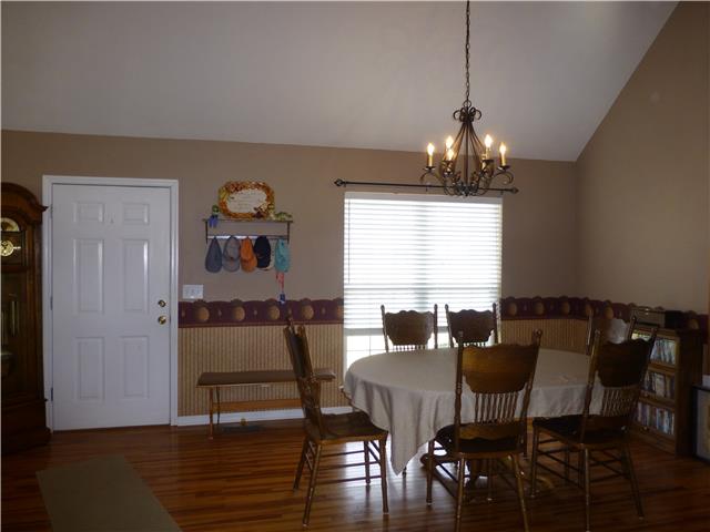 5501 Hunters Point Pike Lebanon, TN 37087 - Photo 10 of 14 Formal dining room with hardwood flooring, vaulted ceiling and new light fixture! Room for everyone and the china cabinet