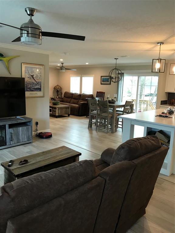 19418 Northwest 246th Street Okeechobee, FL 34972 - Photo 5 of 24 a living room with furniture and a flat screen tv