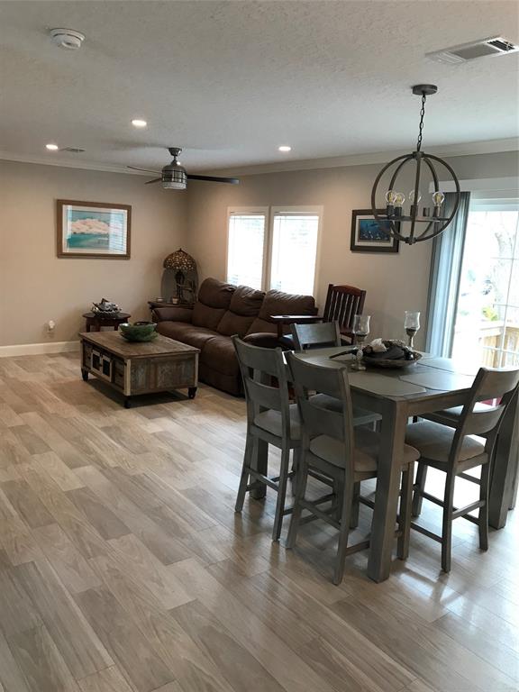 19418 Northwest 246th Street Okeechobee, FL 34972 - Photo 7 of 24 a living room with furniture dining table a window and appliances