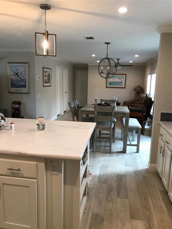 19418 Northwest 246th Street Okeechobee, FL 34972 - Photo 8 of 24 a dining hall with couches a table and chairs in it