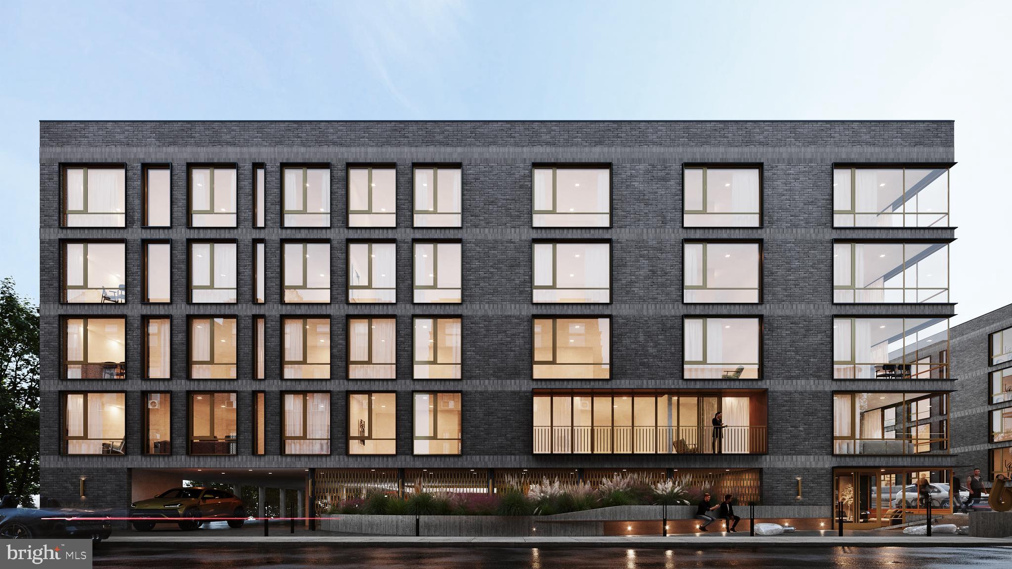 6604 Ridge Avenue, Unit 410 Philadelphia, PA 19128 - Photo 32 of 32 a view of a brick building next to a yard