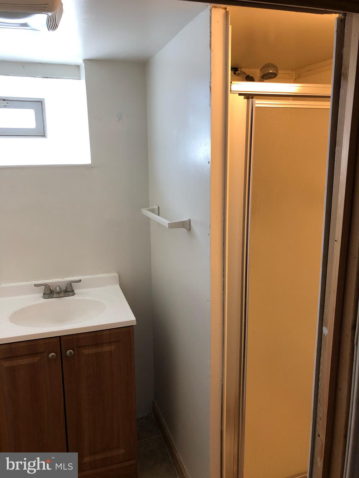 3512 Rhom Road Baltimore, MD 21207 - Photo 22 of 26 Peep of shower in lower level bathroom