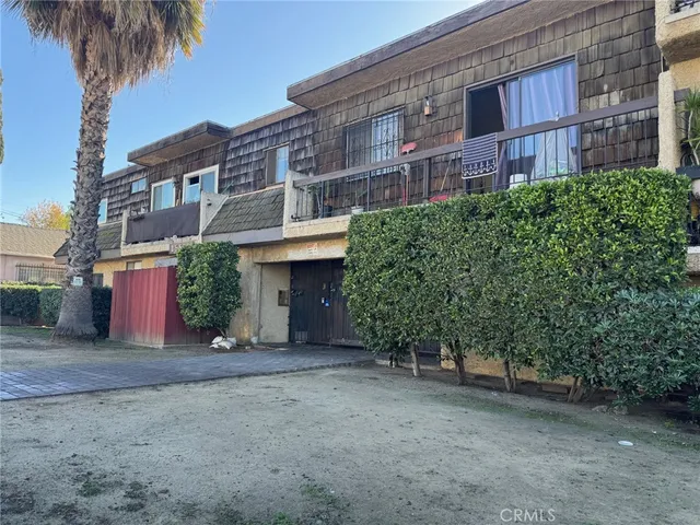 a view of a building with a yard