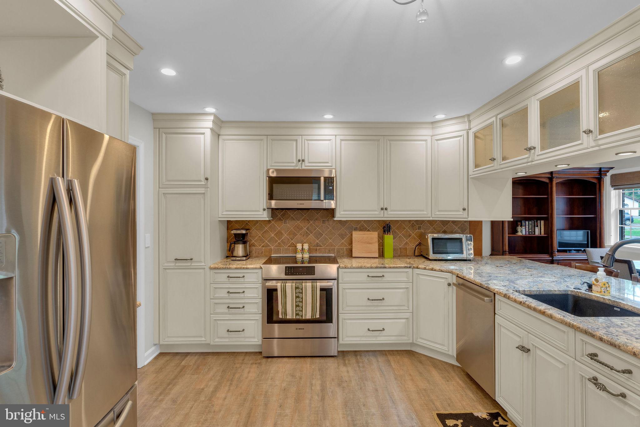 54 John Dyer Way Doylestown, PA 18902 - Photo 12 of 61 a kitchen with stainless steel appliances a refrigerator sink and cabinets