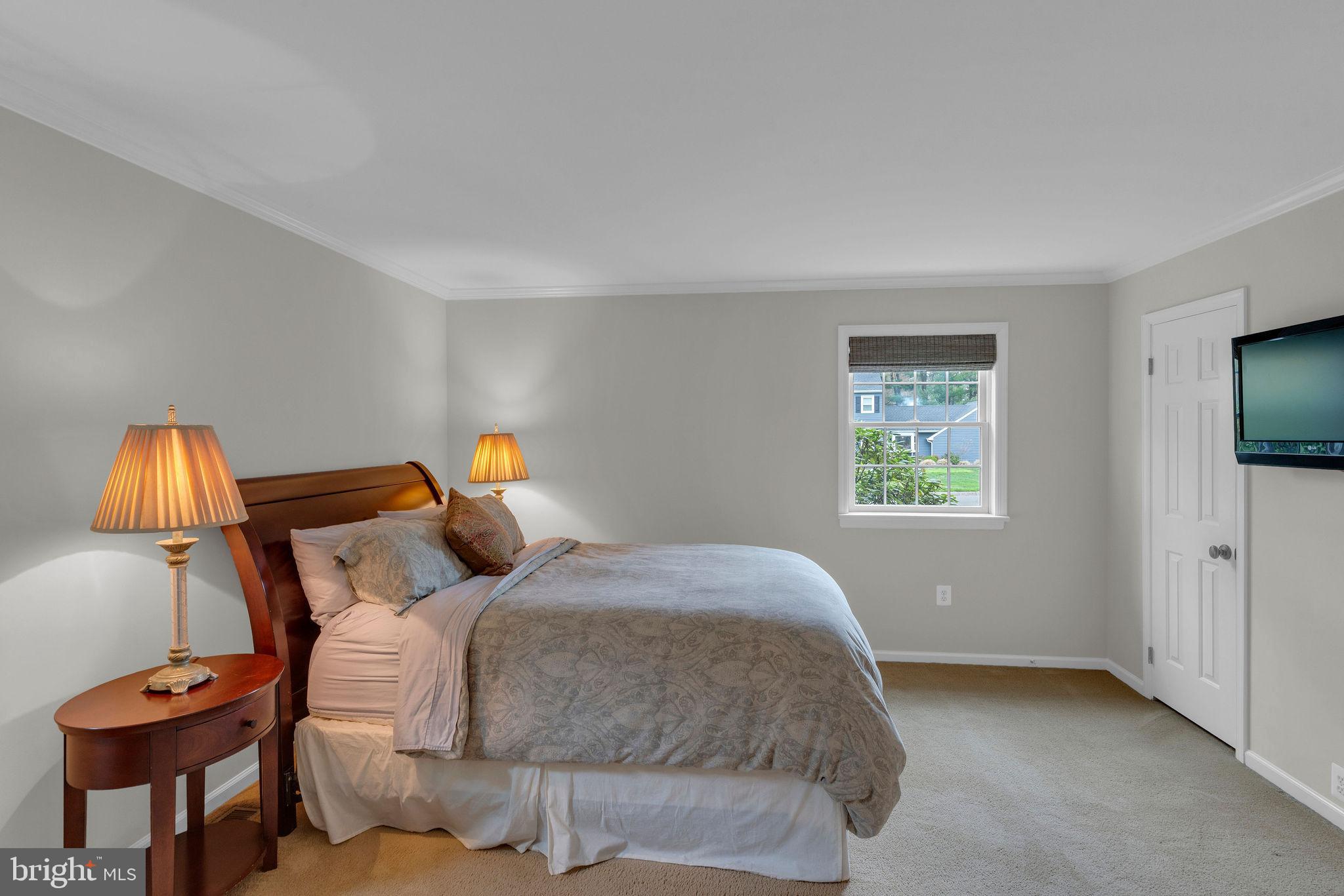 54 John Dyer Way Doylestown, PA 18902 - Photo 25 of 61 a bedroom with a bed and a chandelier