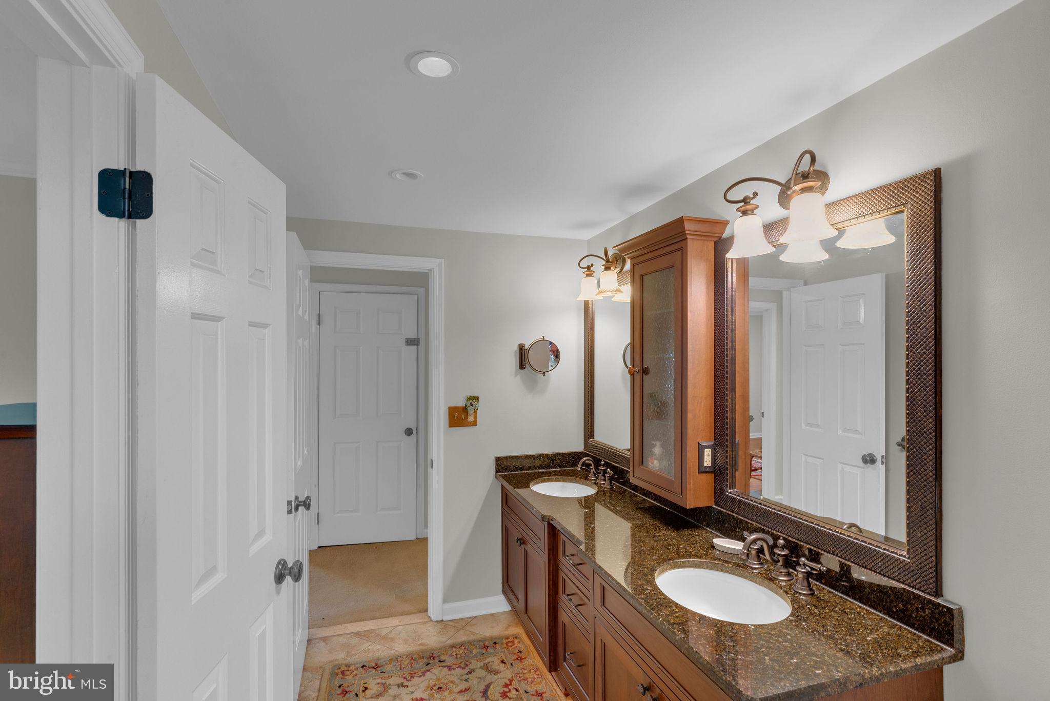 54 John Dyer Way Doylestown, PA 18902 - Photo 26 of 61 a bathroom with a granite countertop sink and a mirror