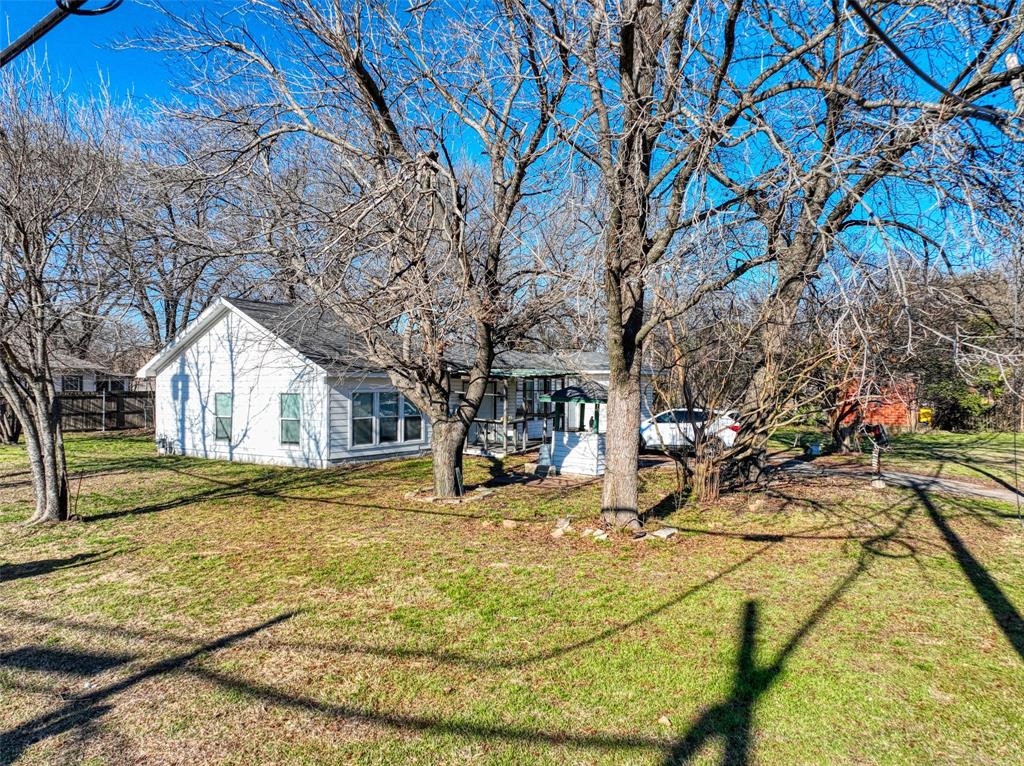 305 East Belt Line Road Wilmer, TX 75172 - Photo 1 of 16 a view of outdoor space yard and basketball court
