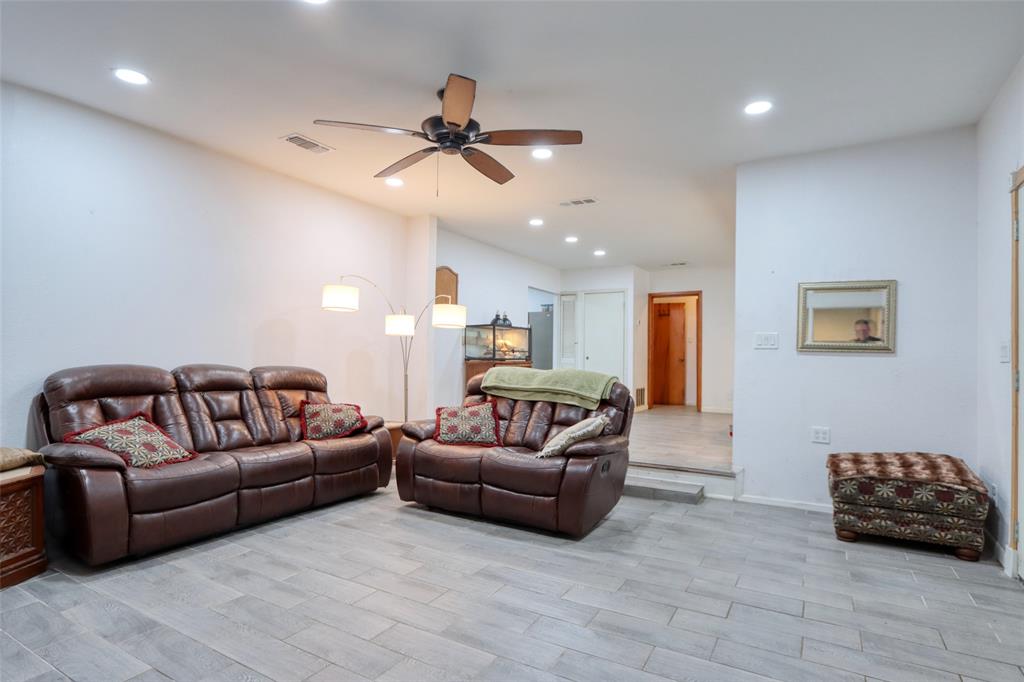 305 East Belt Line Road Wilmer, TX 75172 - Photo 2 of 16 a living room with furniture and a ceiling fan
