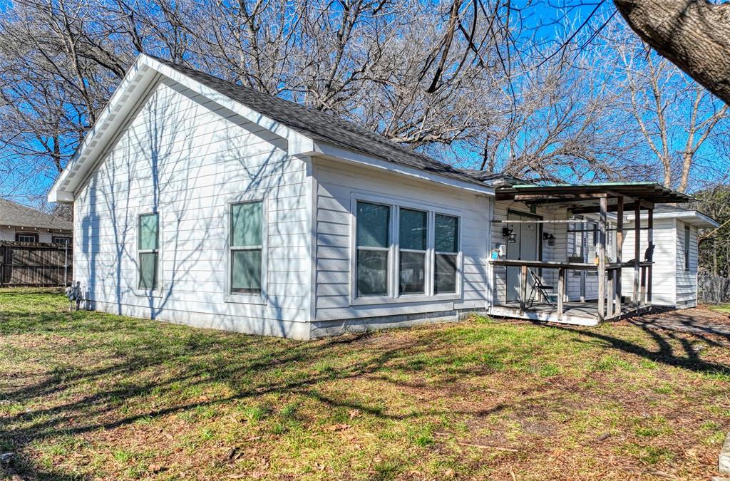 305 East Belt Line Road Wilmer, TX 75172 - Photo 7 of 16 a front view of a house with a patio