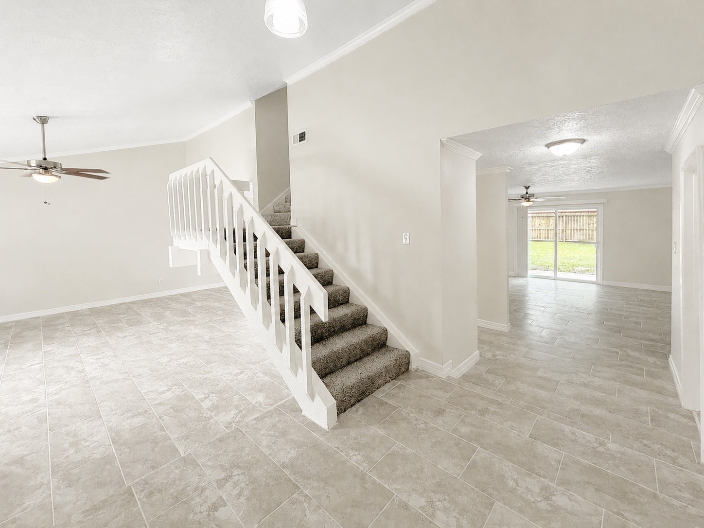 8407 Riverside Walk Lane Houston, TX 77064 - Photo 16 of 33 As you re-enter the home, you’ll find the entry with a guest bathroom, access to garage, and easy flow to stairs and front living space.