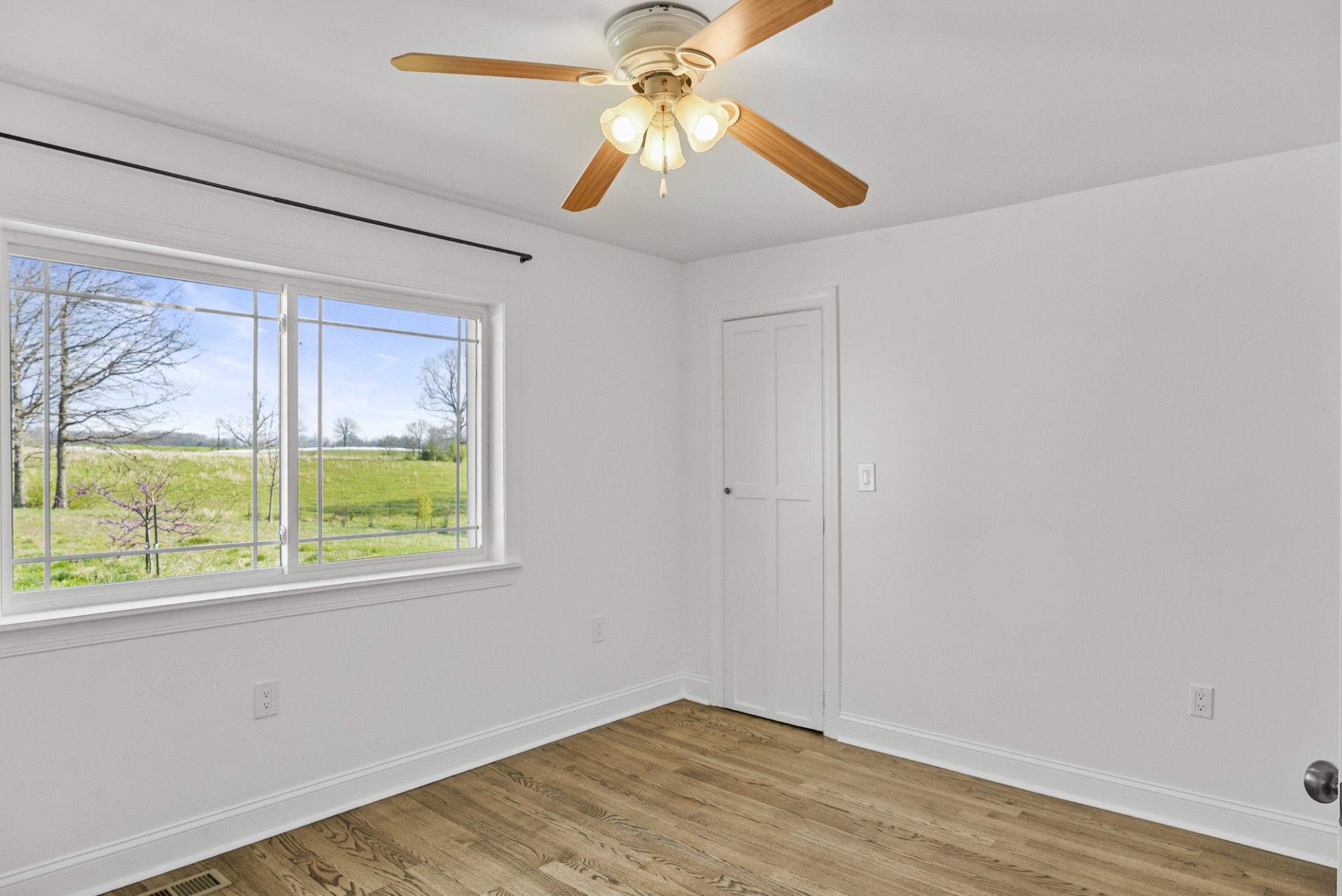 20 Zinker Road Lawrenceburg, TN 38464 - Photo 19 of 39 wooden floor in an empty room with a window
