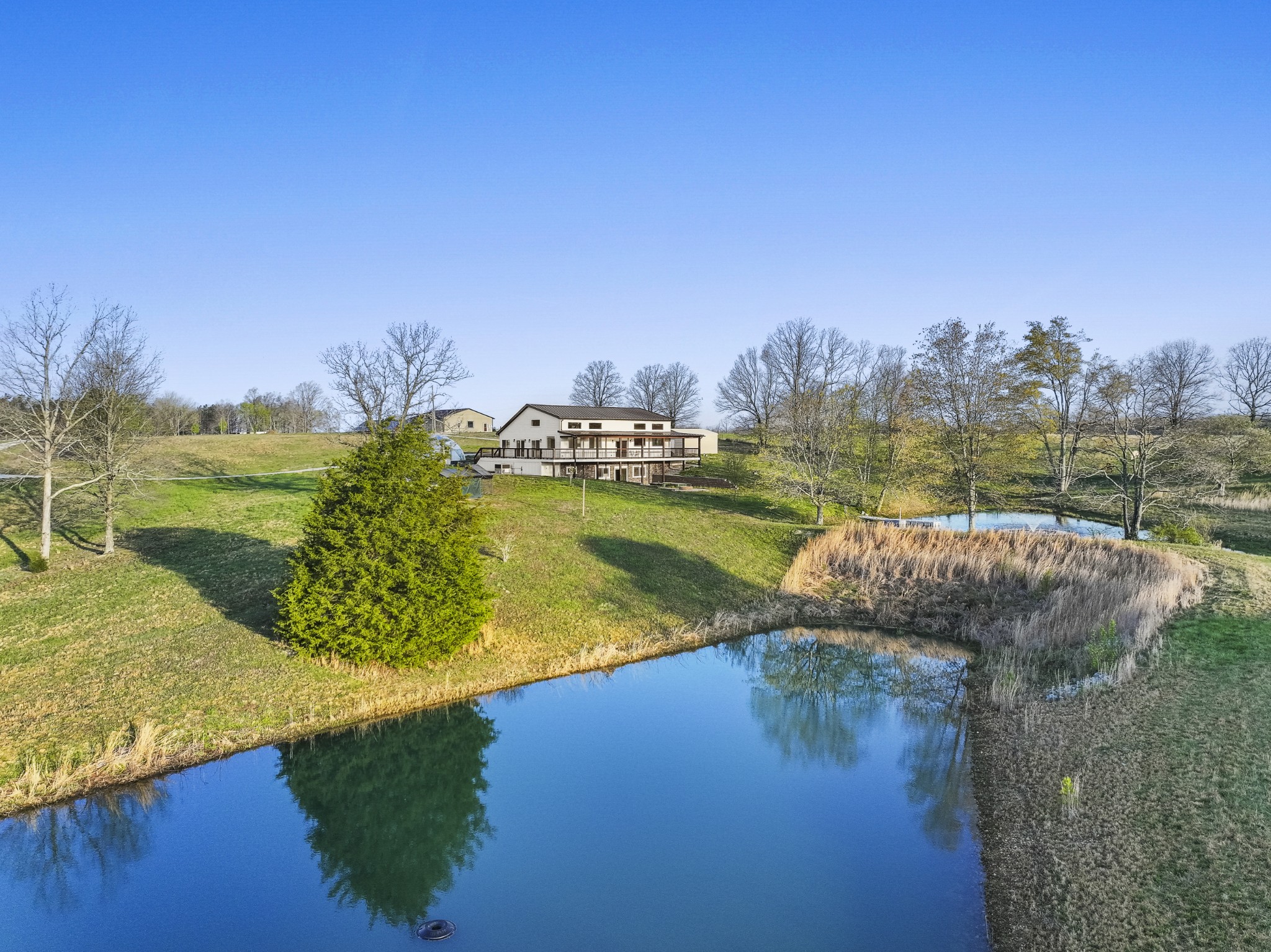 20 Zinker Road Lawrenceburg, TN 38464 - Photo 2 of 39 a view of a lake with houses in the back