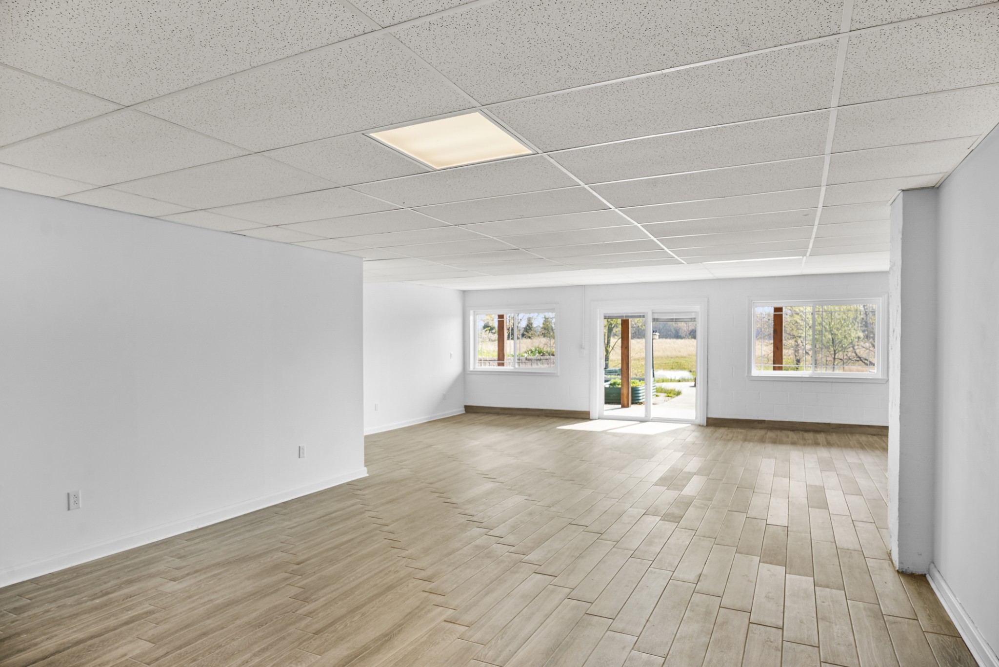 20 Zinker Road Lawrenceburg, TN 38464 - Photo 21 of 39 an empty room with wooden floor and windows