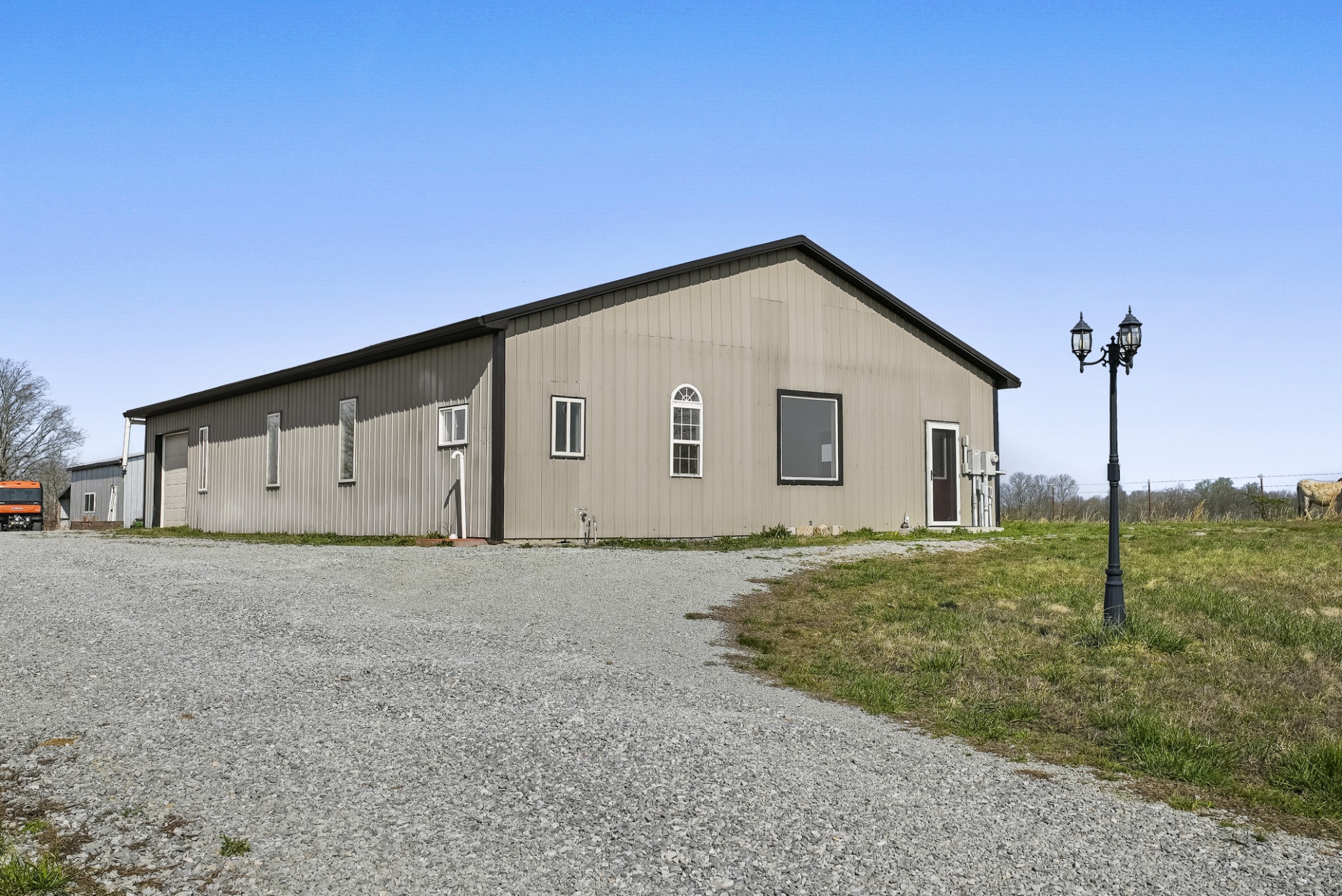 20 Zinker Road Lawrenceburg, TN 38464 - Photo 34 of 39 a view of a house with a backyard and ceiling fan
