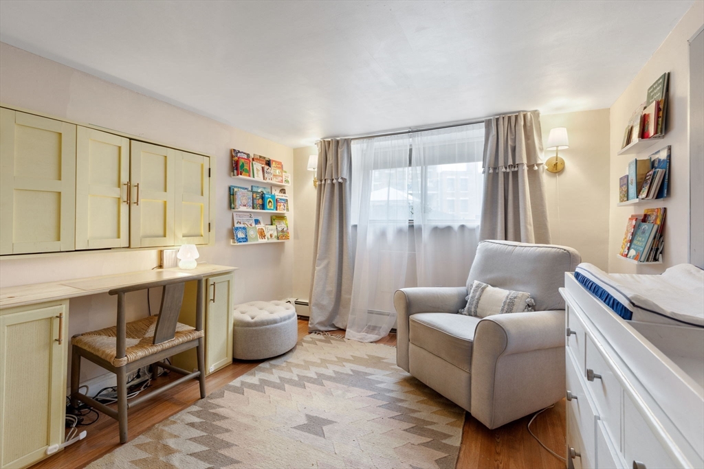 116 Sutherland Road, Unit 1A Boston, MA 02135 - Photo 13 of 21 a living room with furniture and a window