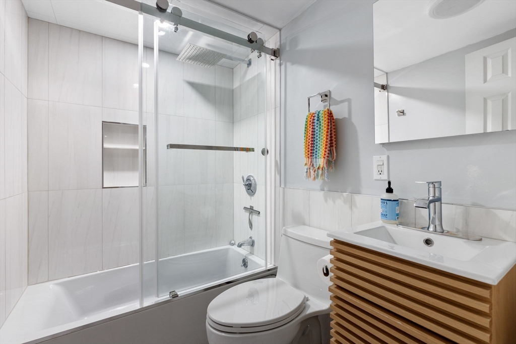 116 Sutherland Road, Unit 1A Boston, MA 02135 - Photo 14 of 21 a bathroom with a sink toilet and shower