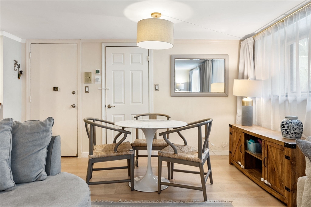 116 Sutherland Road, Unit 1A Boston, MA 02135 - Photo 6 of 21 a view of a livingroom with furniture and a window