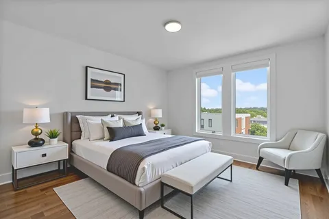 a bedroom with a bed and a couch