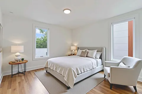 a bedroom with a bed and a lamp