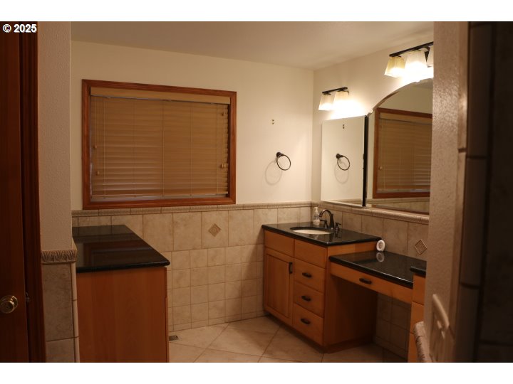 6503 Kinns Road Northeast Woodburn, OR 97071 - Photo 22 of 45 a bathroom with a sink and a mirror