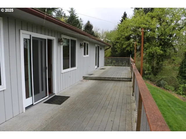 a view of house with backyard and garden