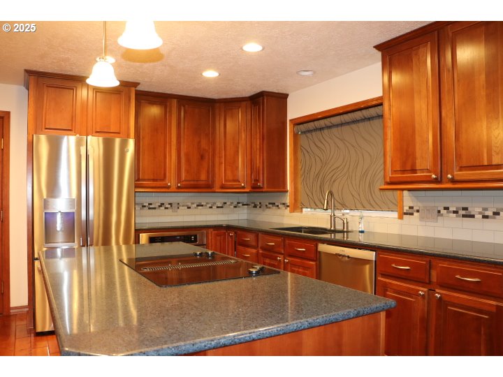 6503 Kinns Road Northeast Woodburn, OR 97071 - Photo 7 of 45 a kitchen with a sink and cabinets