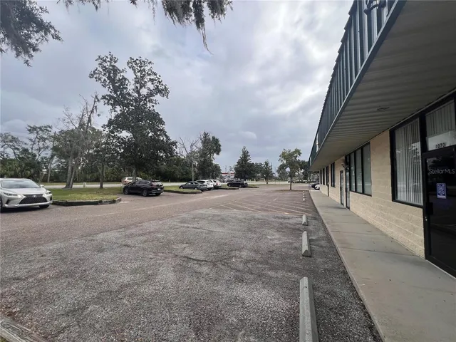 a view of street with parked cars