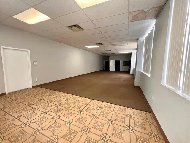 a view of hallway with a large window