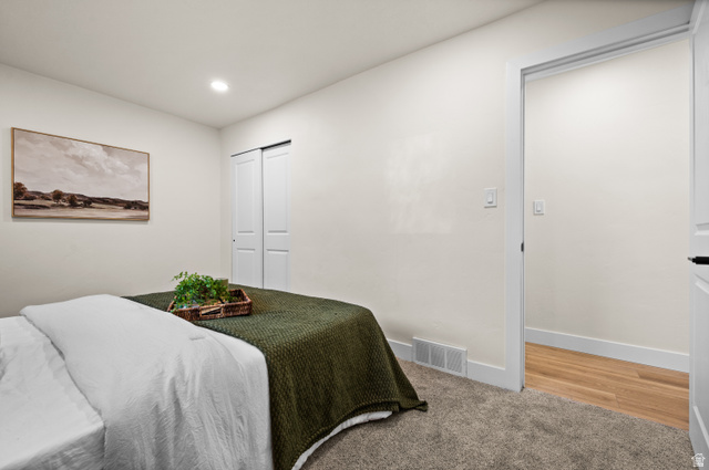 189 West Center Street Midvale, UT 84047 - Photo 20 of 64 Carpeted bedroom featuring a built-in sliding door closet, recessed lighting, and a white baseboard trim