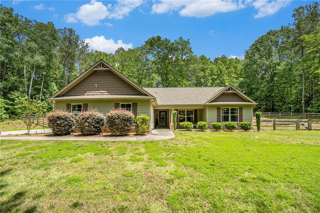1199 Witcher Road Newnan, GA 30263 - Photo 1 of 1 a front view of a house with yard and green space