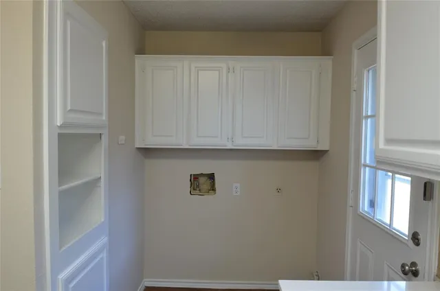 a view of cabinets and window