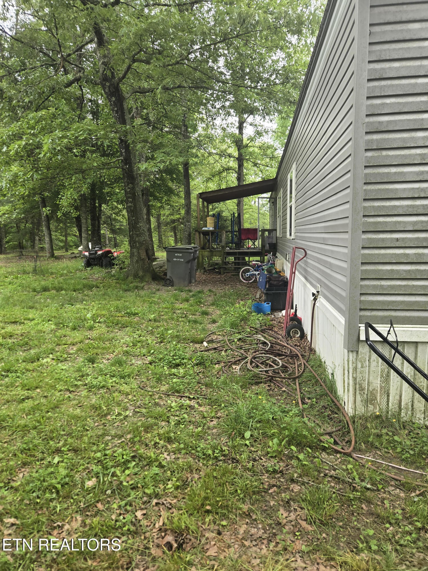 182 Huse Potter Road Lancing, TN 37770 - Photo 2 of 4 a view of a backyard with sitting area