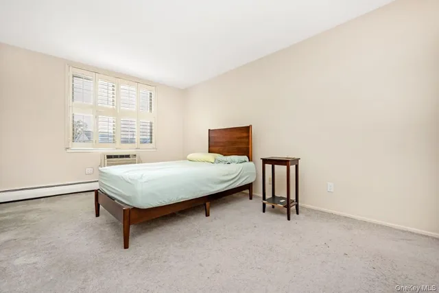 a bedroom with a bed and a table in it