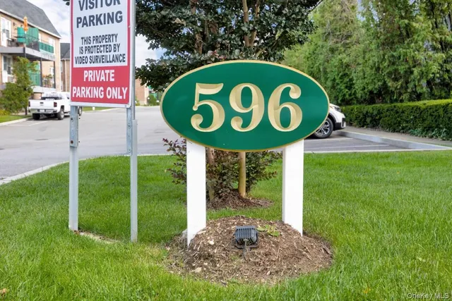 a sign that is on a brick wall