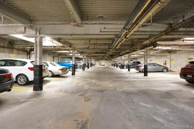 a view of parking garage with cars