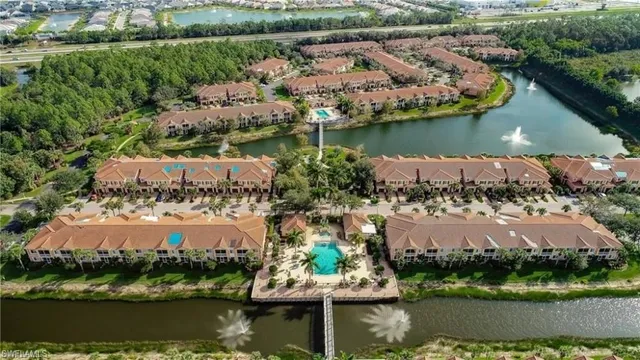 an aerial view of house yard and lake view