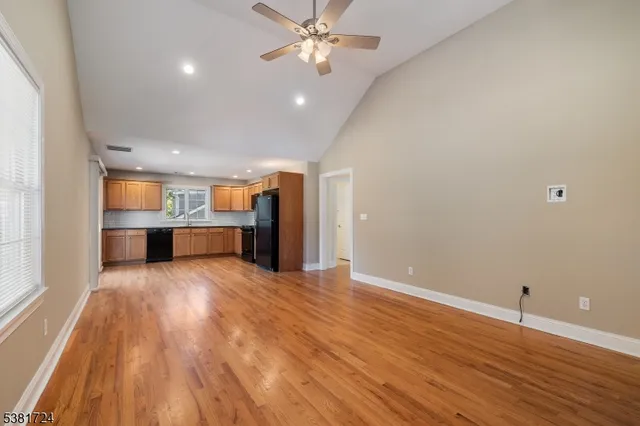 a view of kitchen with wooden floor