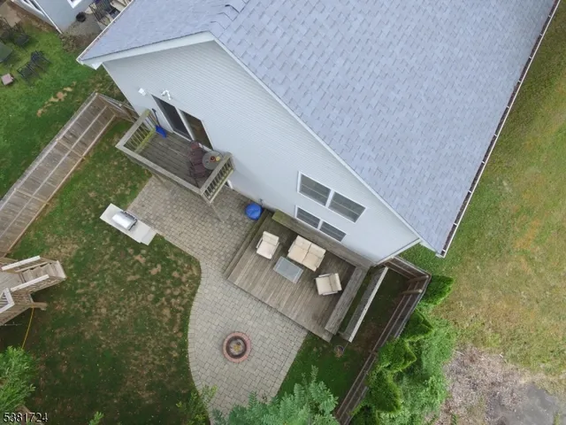 an aerial view of a house with roof deck